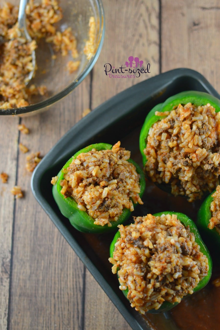 stuffed green peppers in baking dish
