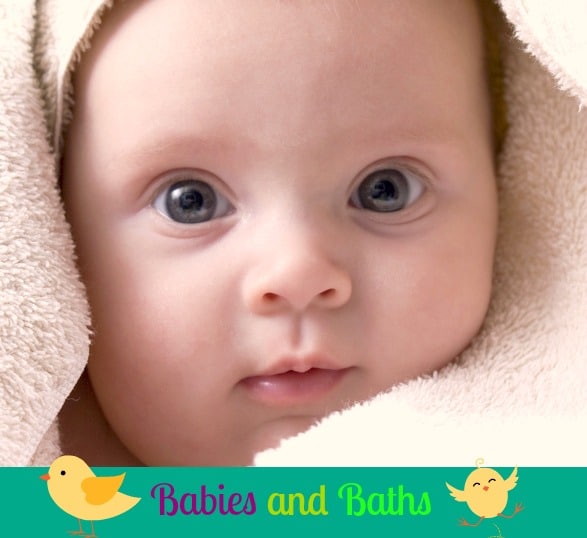 Cute little four month old baby wrapped in a towel.