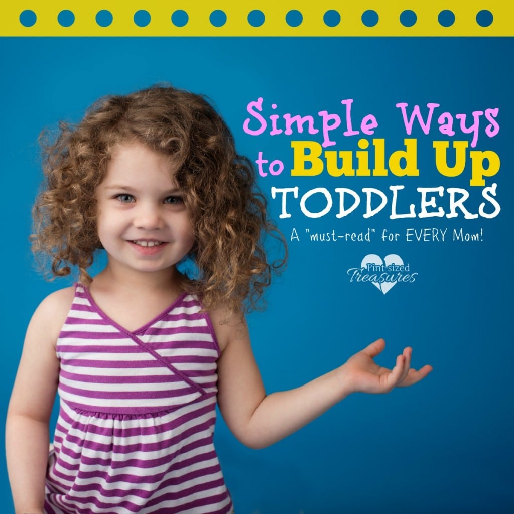 happy toddler holding hand out