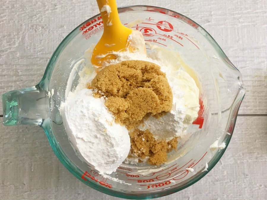 mixing the sugar and cream cheese for the cheesecake dip