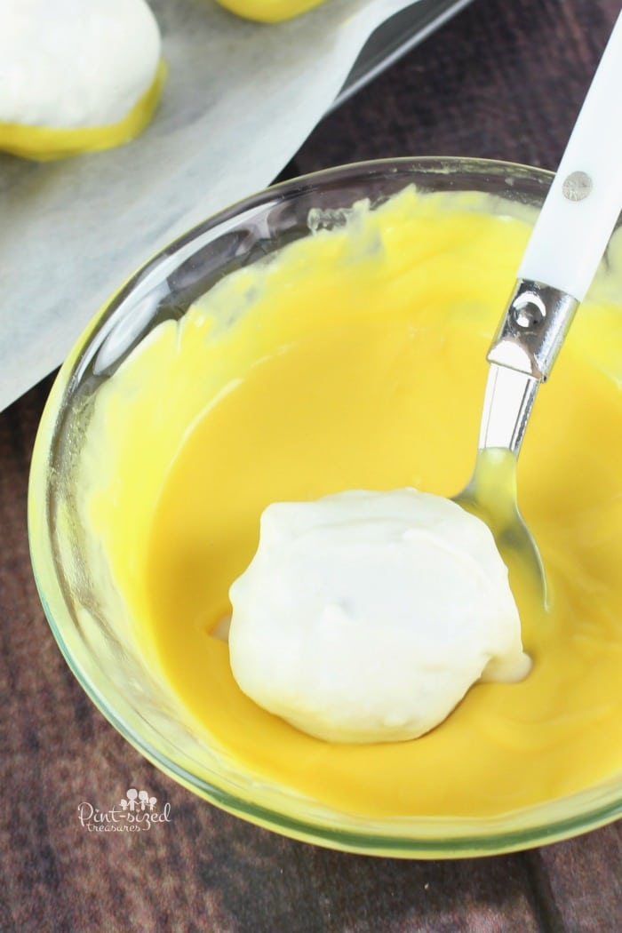 dipping banan nut bread truffles in white chocolate
