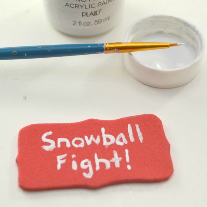 painting the DIY snowball fight Christmas ornament