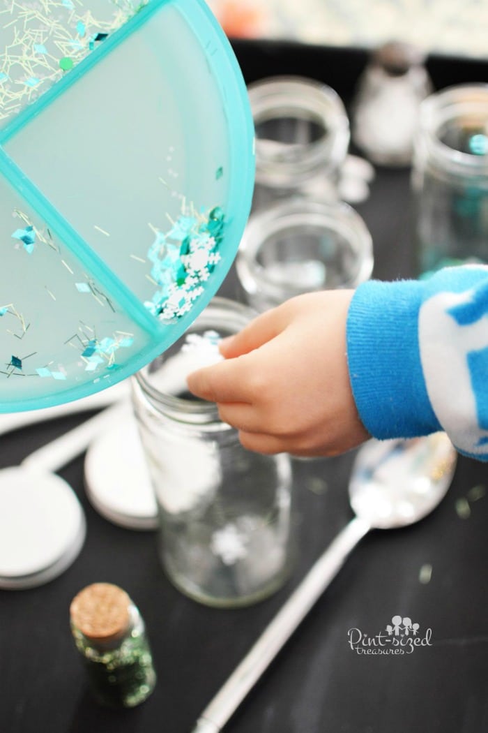 putting the glitter in the DIY Christmas snow globe