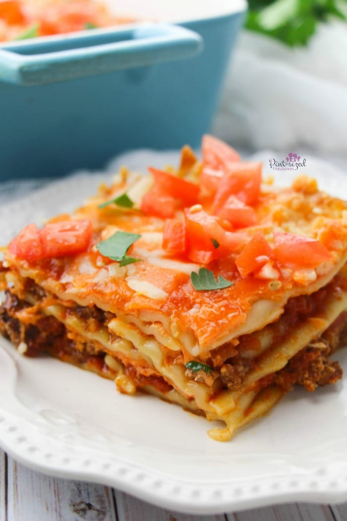 Love Mexican and Italian food? We've got a crazy-easy recipe that your foodie heart will crave! Easy taco lasagna is ready in minutes and it's proven to be a family fave! Grab the easy recipe now! #easyrecipe #tacolasagna #tacobake #tacorecipes #easylasagna #Mexicanfood #Italianfood #comfortfood #easydinneridea #easylunch #cheesymeal