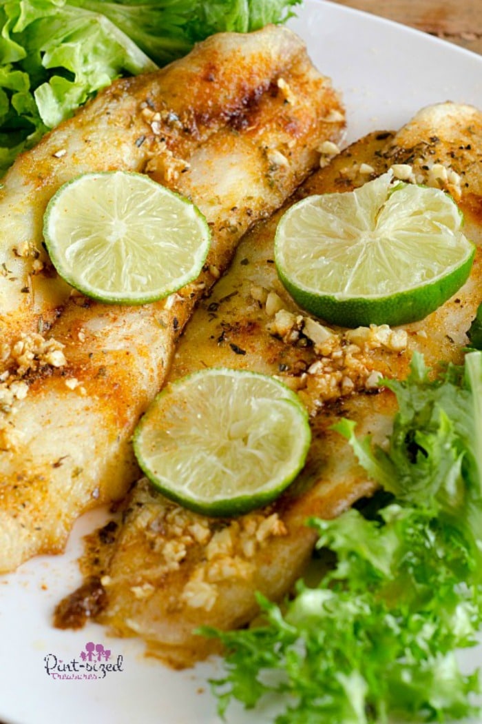 Easy, five-spiced, baked fish is absolutely delicious! t's ready in just minutes and is packed full of fresh flavors and spices! #bakedfishrecipe #easybakedfish #fishrecipes #easymealidea #easydinner #quickandeasymeal #bakedfishmeal #20minutemeals #familyrecipes