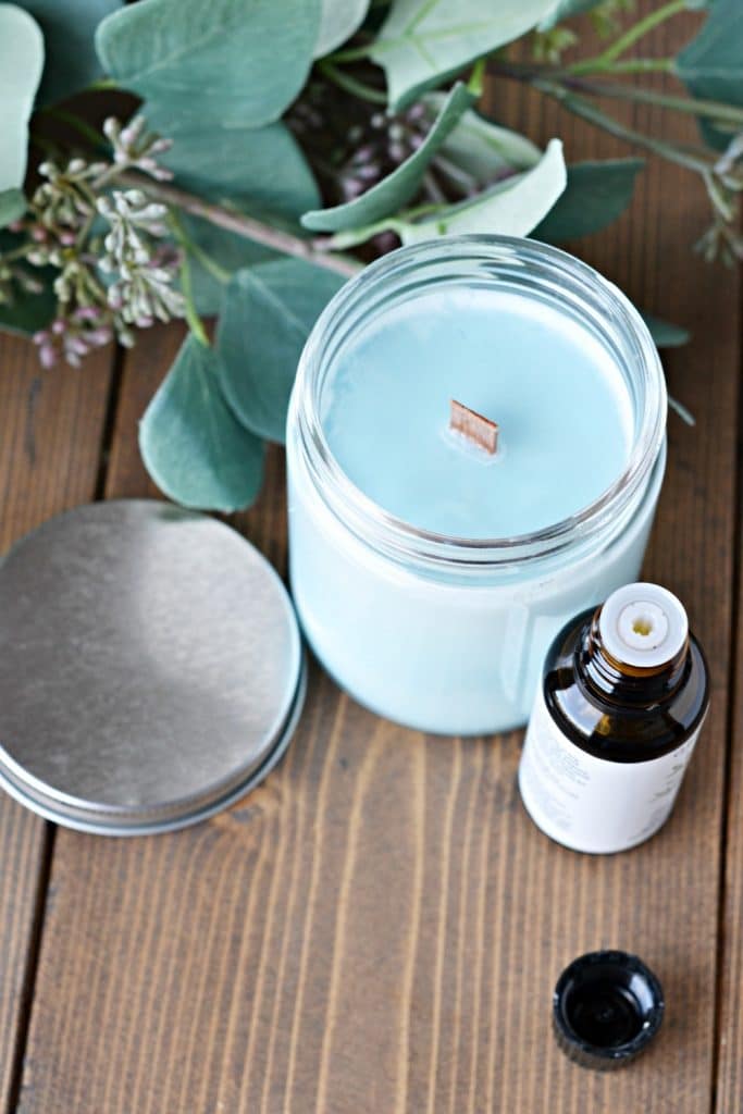 enjoying essential oils and candles to relax for self care in motherhood