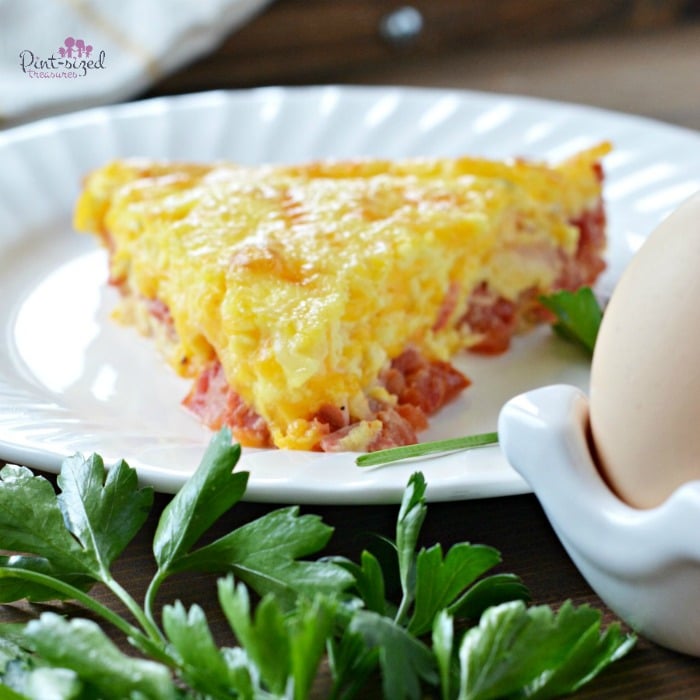 Crustless, easy quiche with bacon on serving plate
