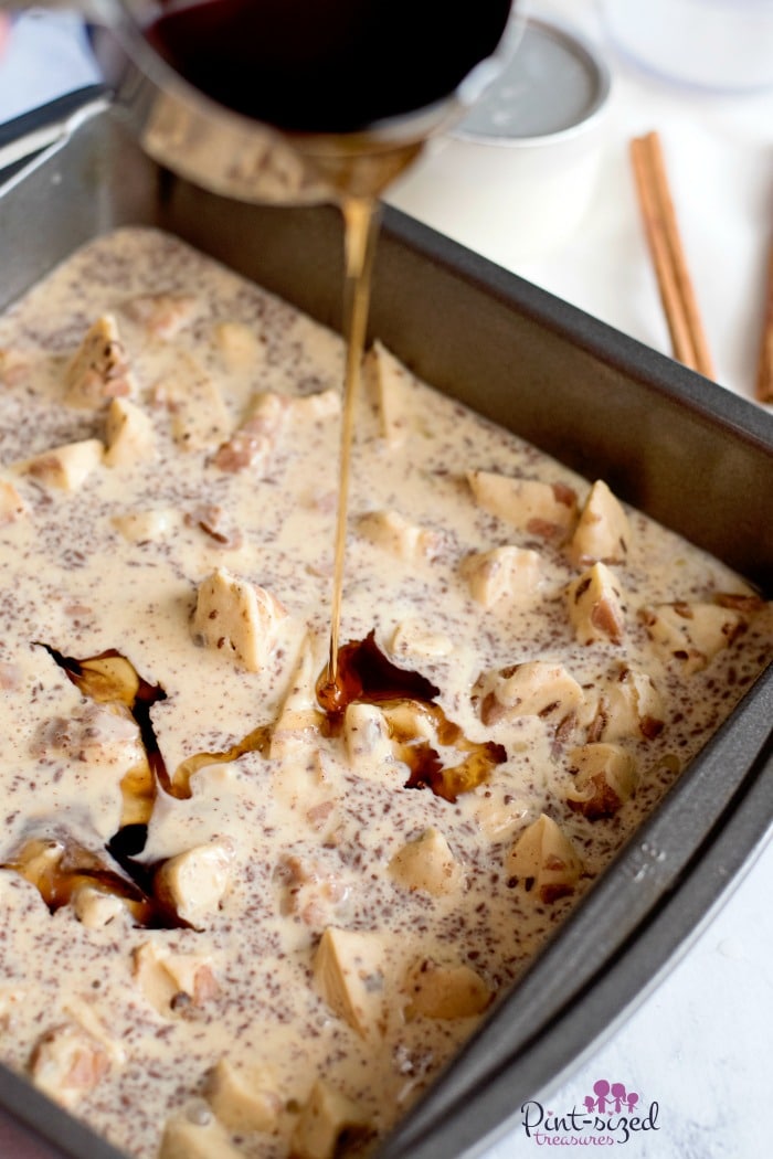 Pouring maple syrup onto baked french toast