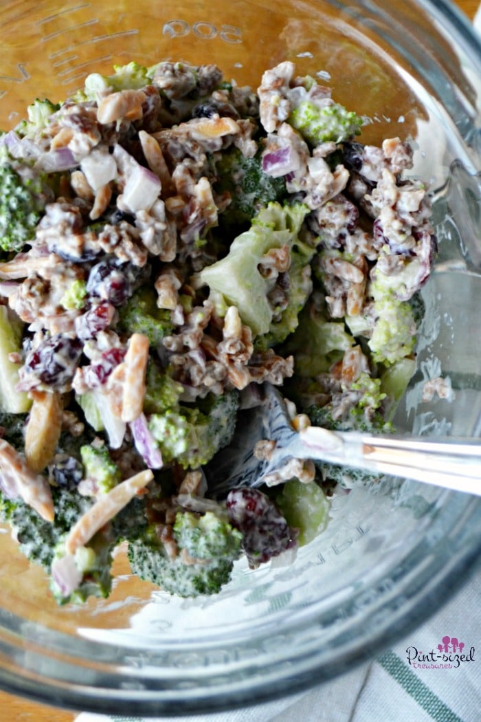 mixing the broccoli salad