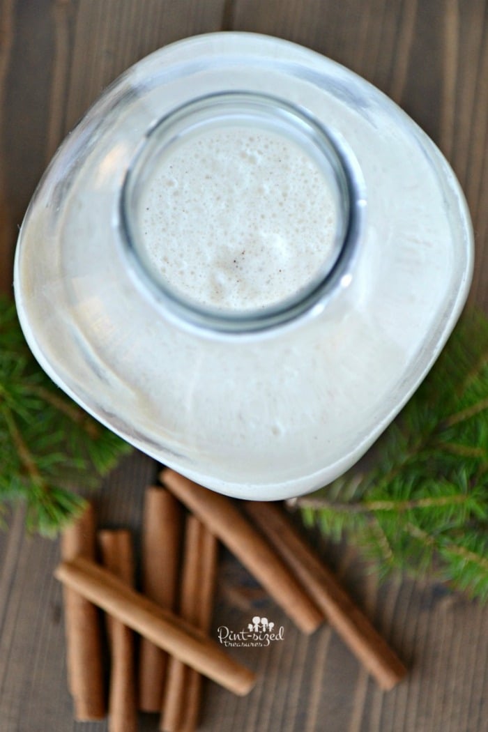 placing egg nog into pourable jar