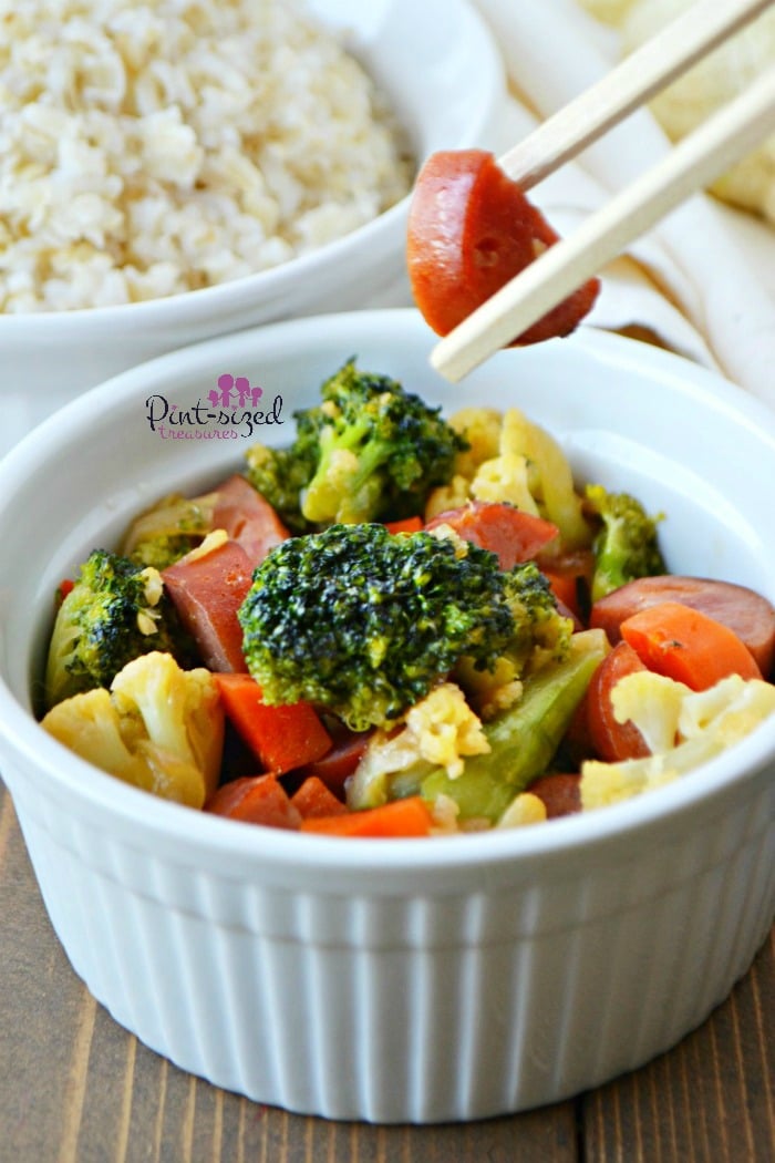 Make this super simple, Sausage and veggie stir-fry recipe for a hearty, easy and yummy meal! Made with fresh veggies and our favorite sausage, it's perfect for busy families and even dinner guests! Grab your chopsticks!