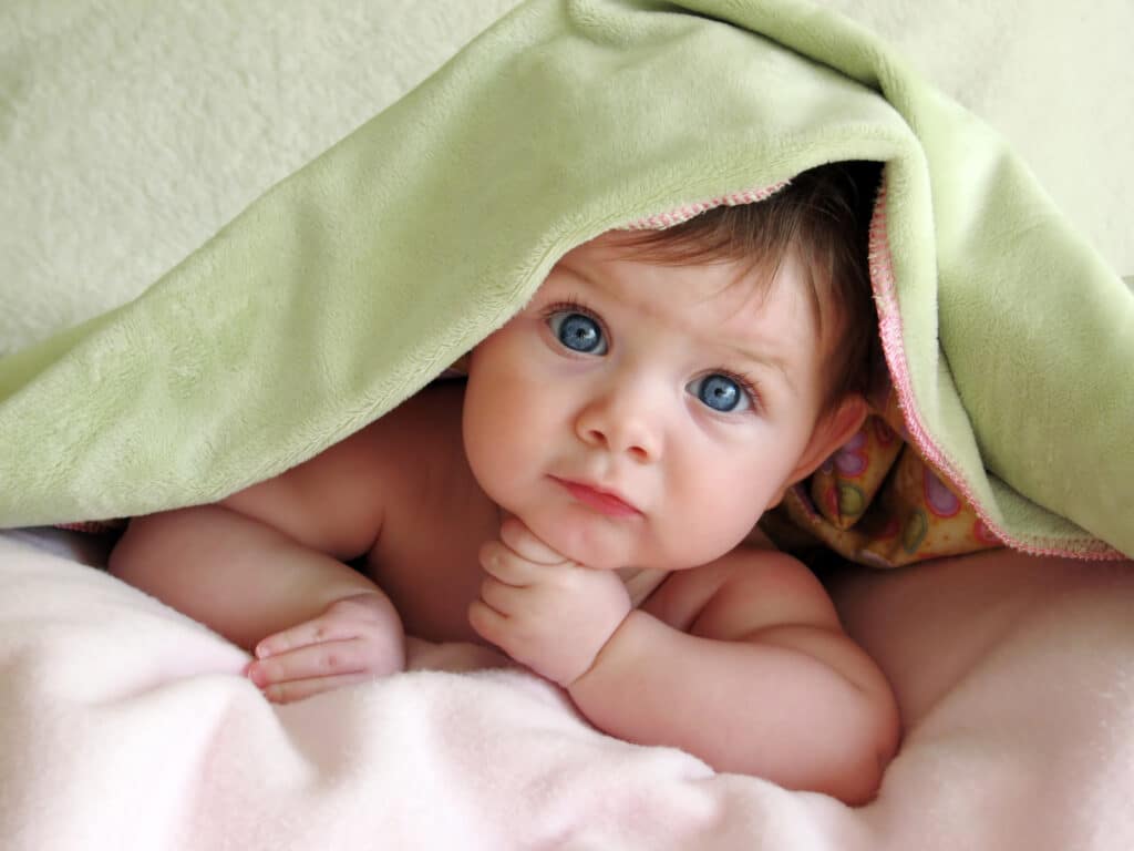 baby under a cover 