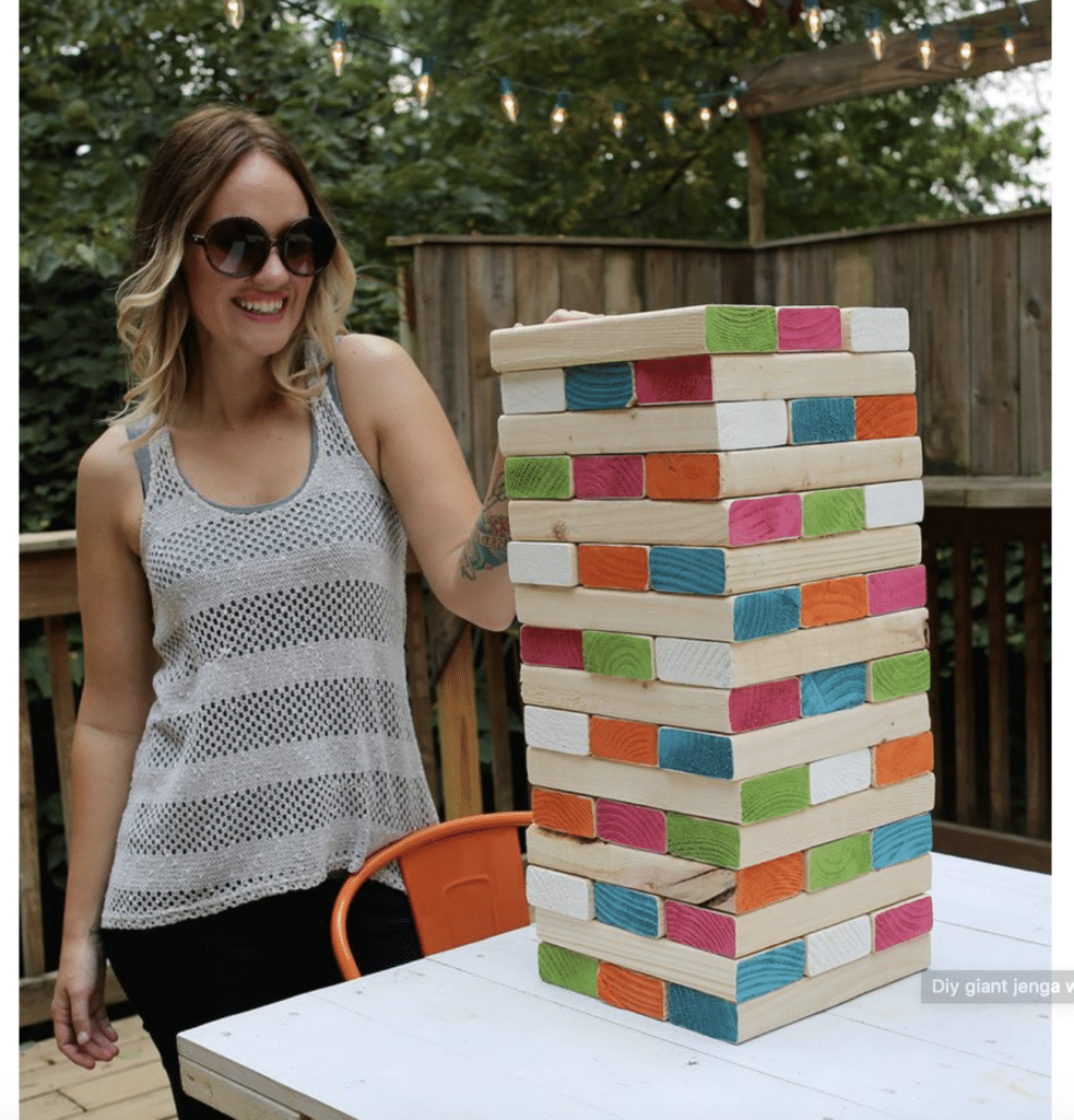 playing an outdoor game called Jenga