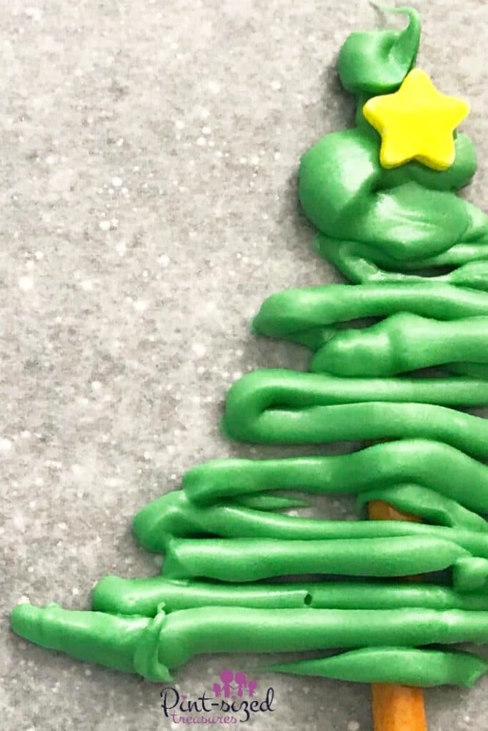 Melted green chocolate on pretzel Christmas tree