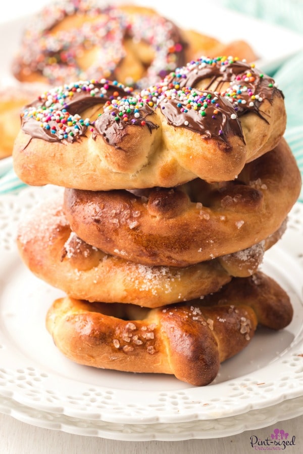 homemade soft pretzels stacked on serving plate