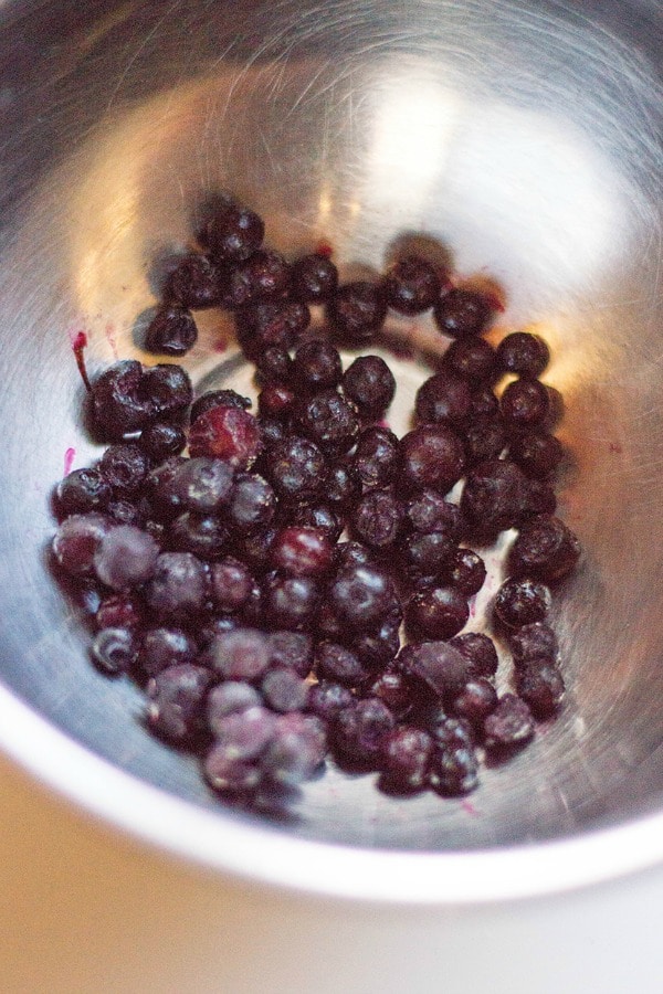 prepping blueberries for muffins