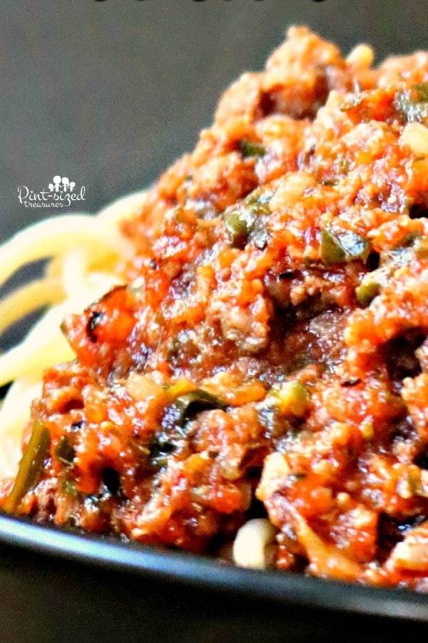 homemade bolognese sauce on black plate