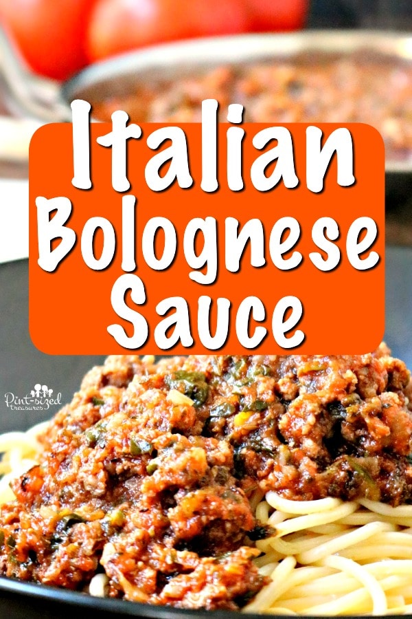 bolognese sauce over buttered noodles