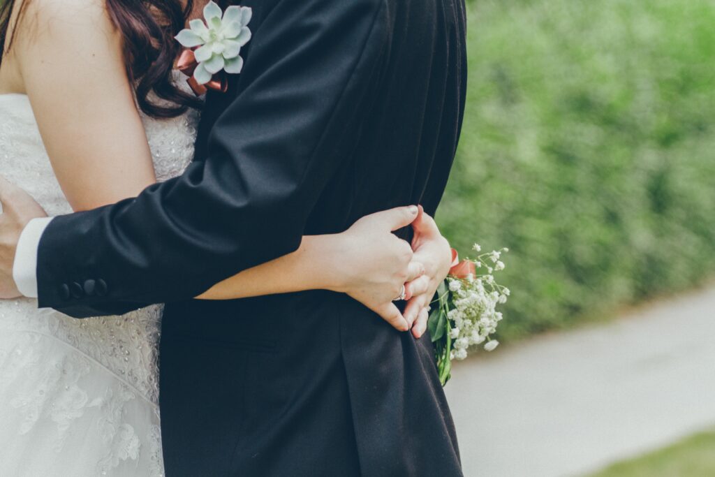 new husband and wife embracing as they focus on loving each other more