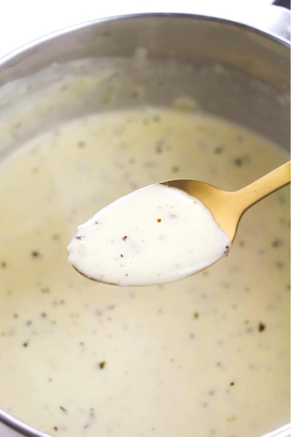taste-testing the Alfredo Sauce