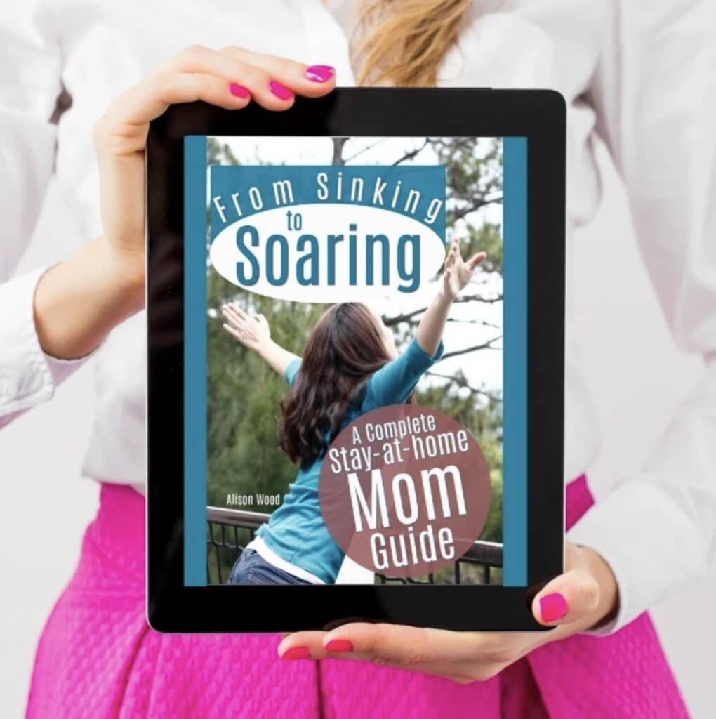 lady holding the mom guide