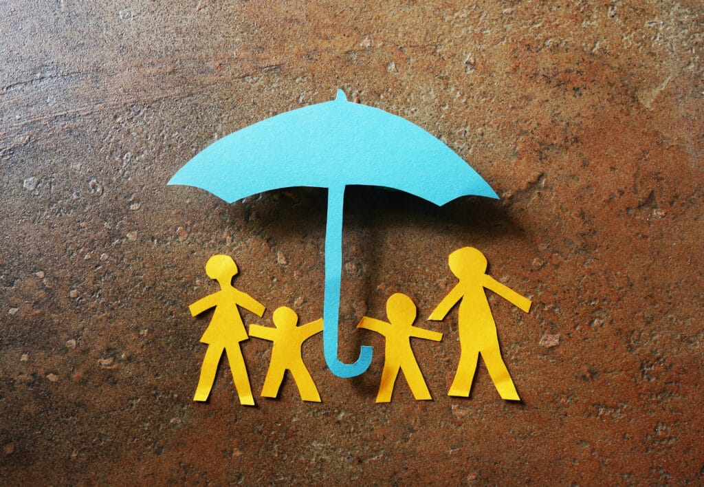 picture of a family cut out of paper depicting selfish parents