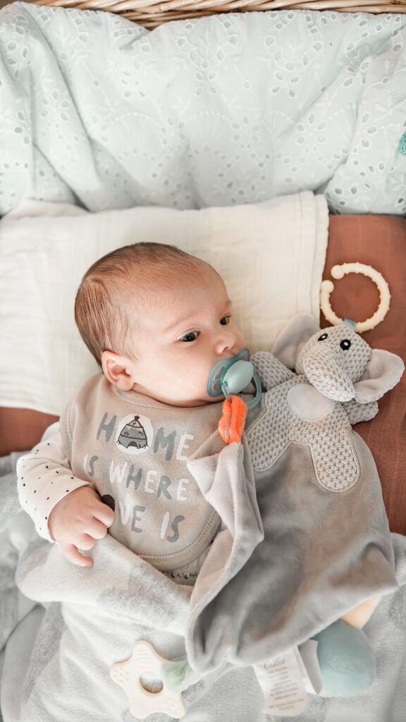 baby with a pacifier at baby shower