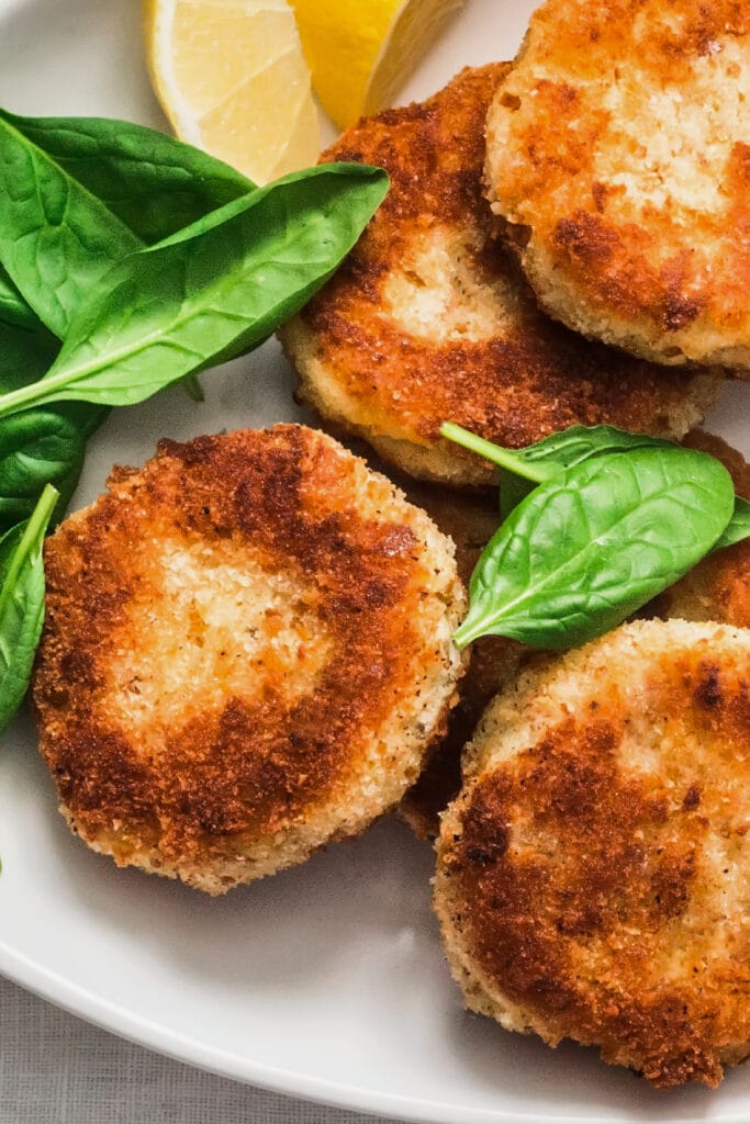 salmon patties on white serving plate