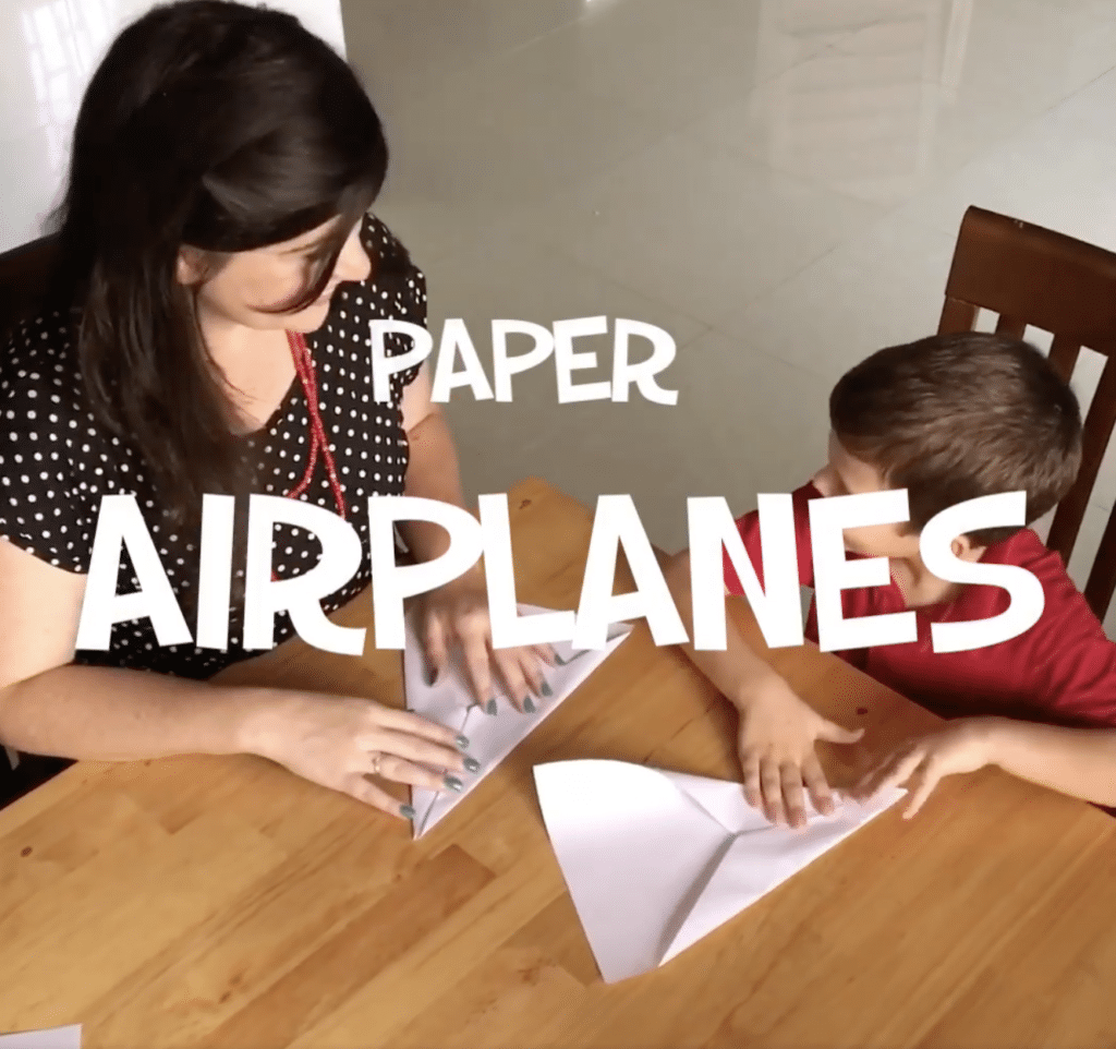 making paper airplanes with kids for a fun kids activity