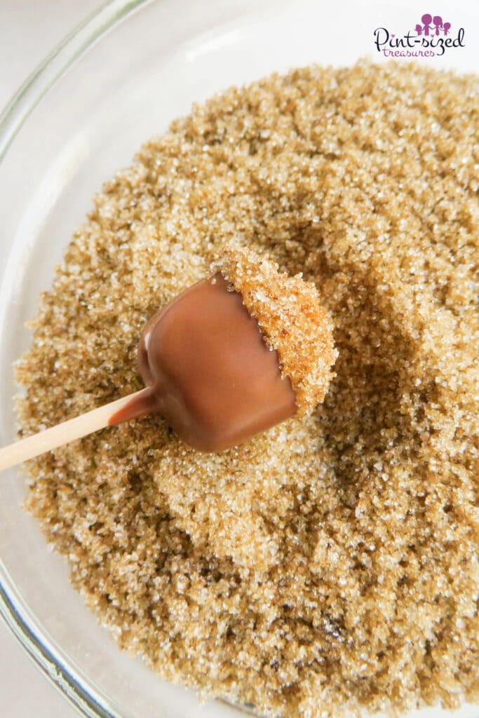 rolling marshmallows in brown sugar for the fall acorn treats