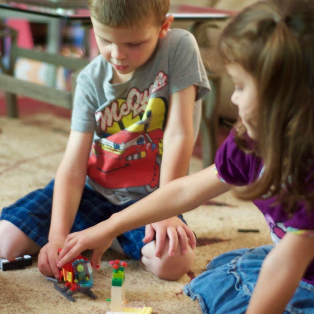 kids playing at home with a productive mom
