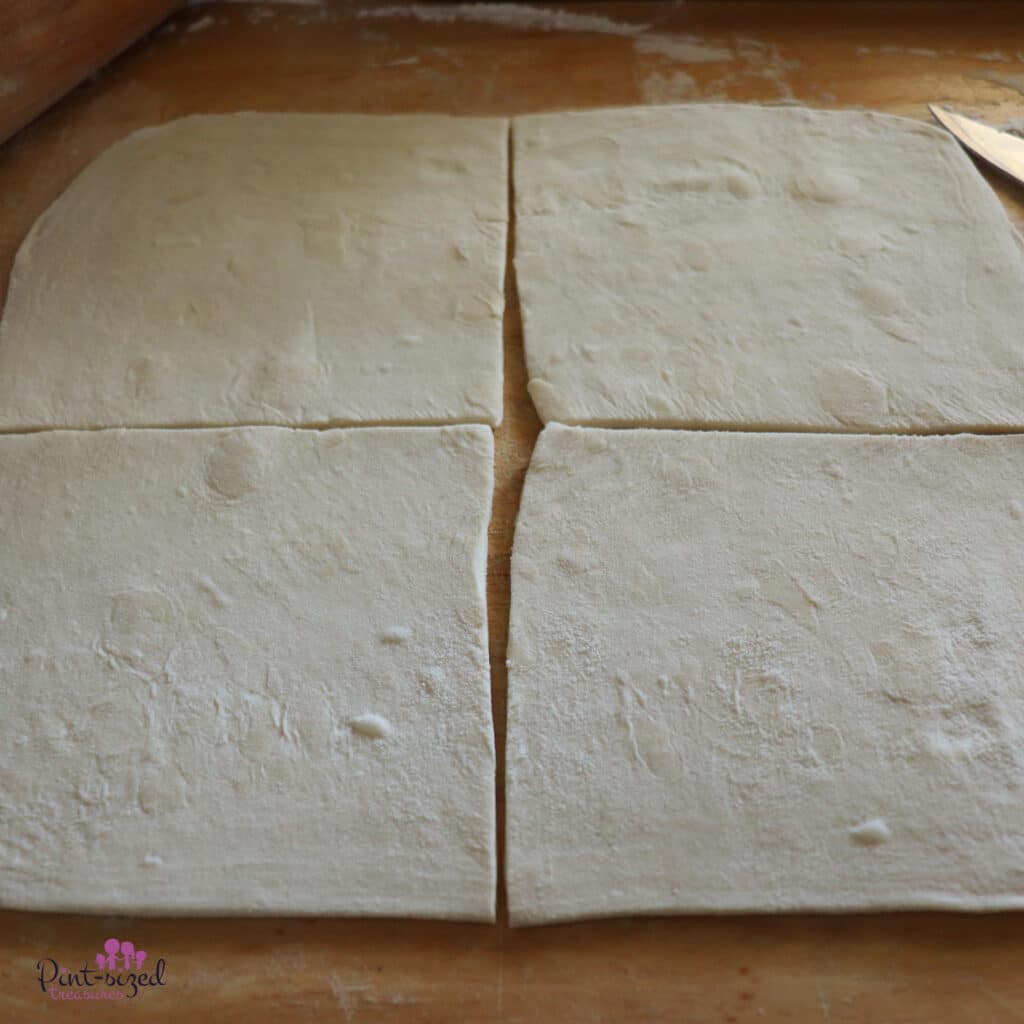 rolling out pastry for pumpkin turnovers