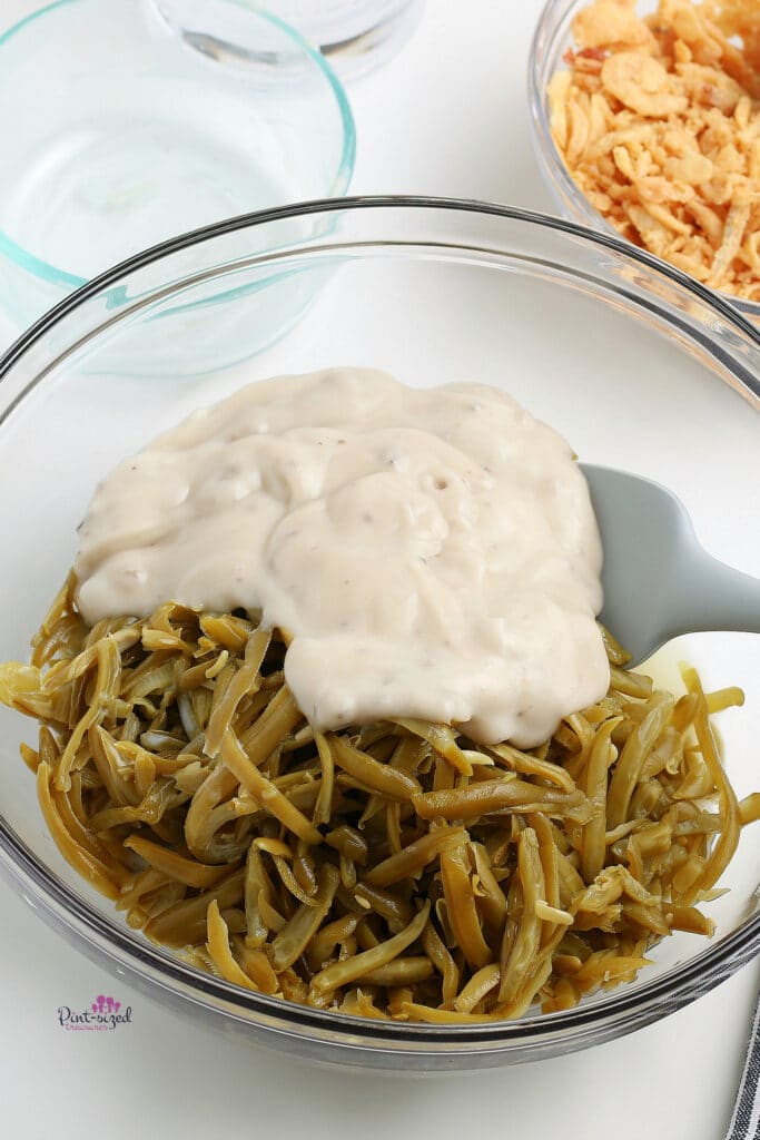 mixing the ingredients for the green bean casserole recipe