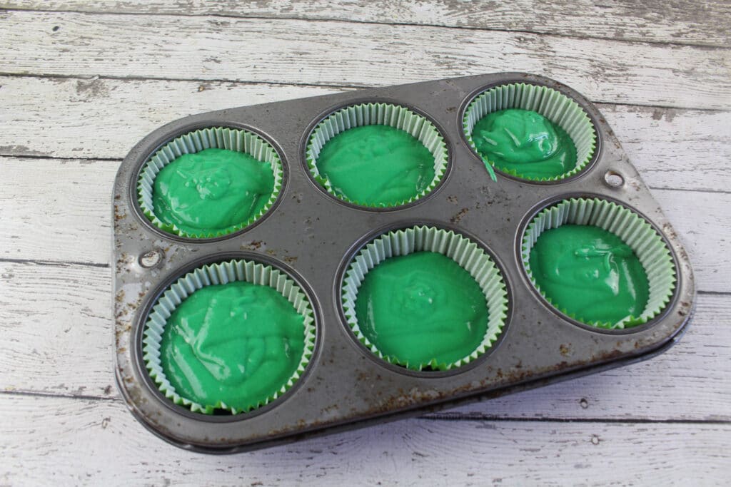 watermelon cupcake batter in cupcake liners