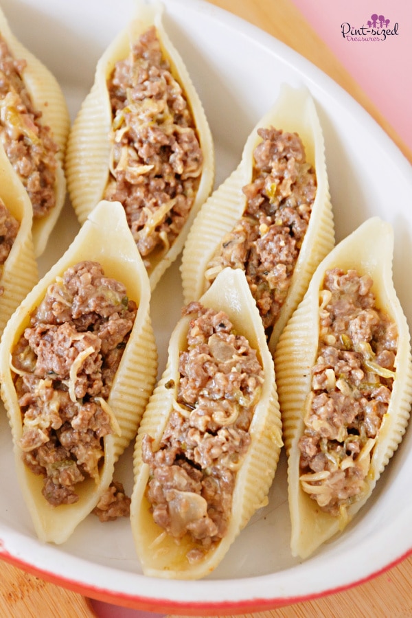 filling shells with cheeseburger mixture