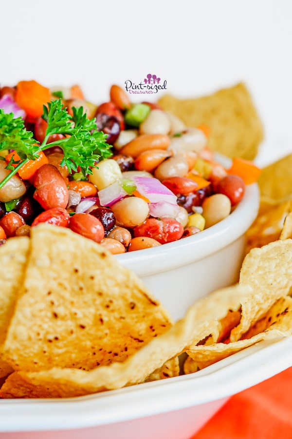 cowboy caviar in bowl with chips on the side