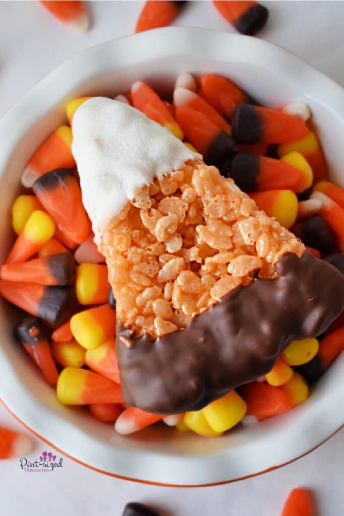 candy corn Rice Krispie treats in bowl of candy corn