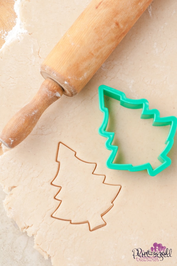 christmas tree cookies being rolled out