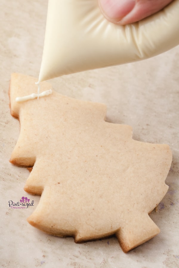 frosting the Christmas tree cookies