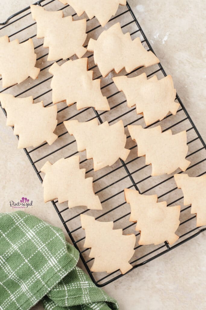 baked christmas cookies, unfrosted on cooling rack