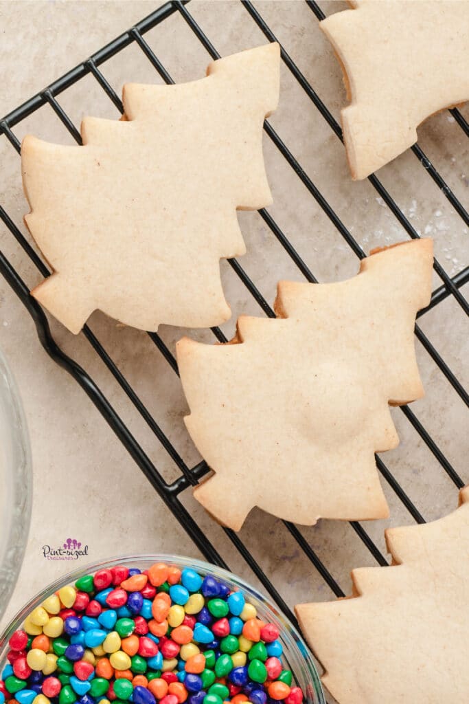 baked Christmas tree cookies on cooling rack