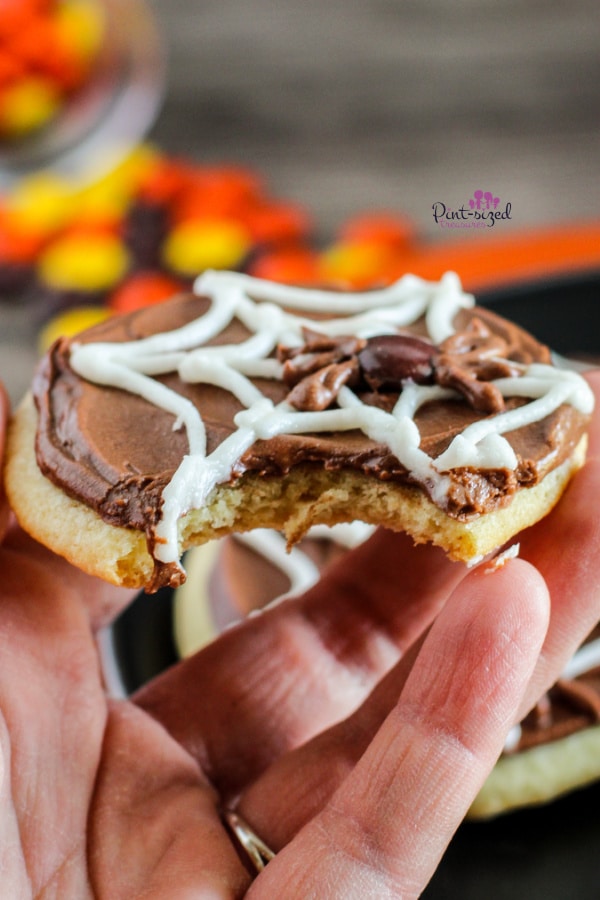 showing a bite of the spider web cookie recipe