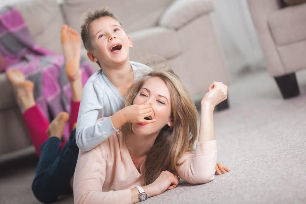 son and mom playing charades