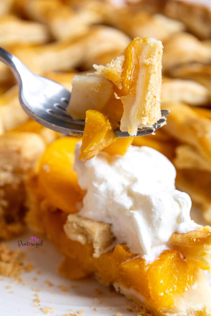 taking a bite of the homemade peach pie