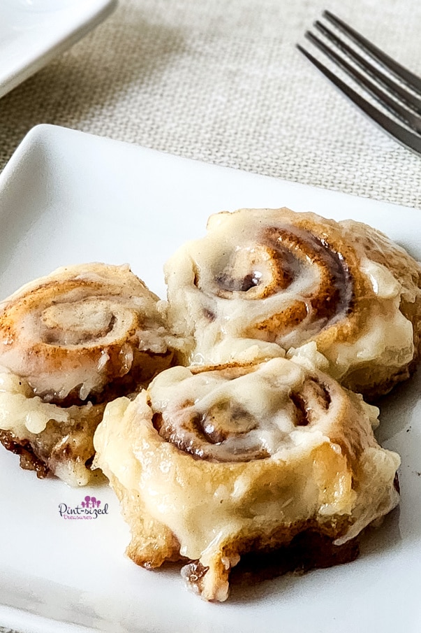 3 cinnamon buns on a plate