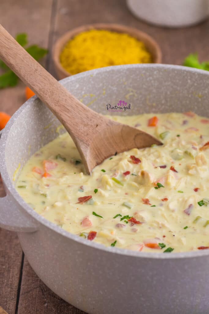 stirring chicken crack noodle soup